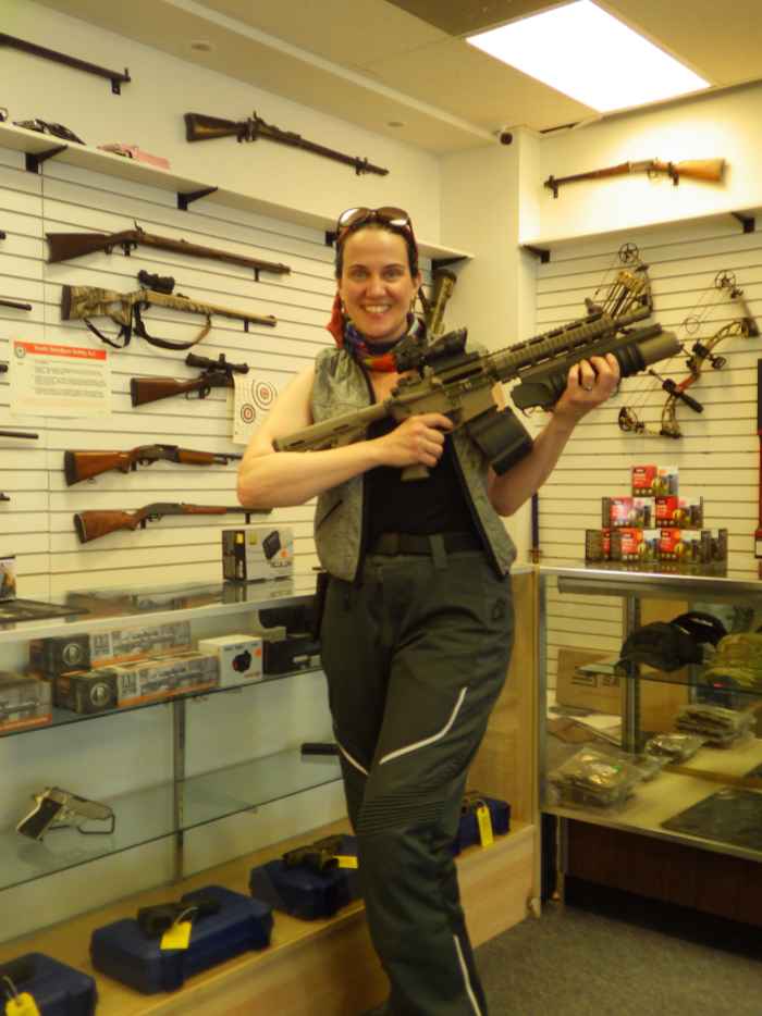 NMBL holding an assault rifle at Sector Gun Shop in Spanish Fork.